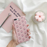 Funda para iPhone rosa con estampado de caras de melocotón